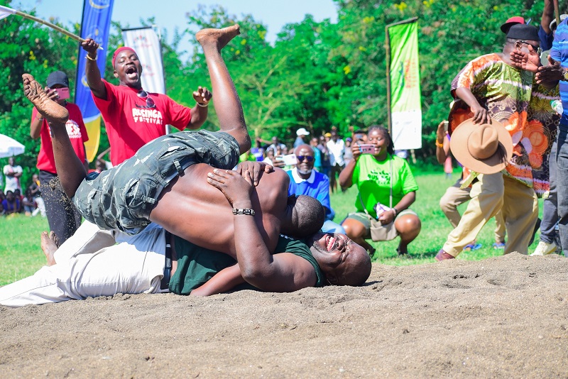 wrestlers bringing each other down at a rusinga festival event